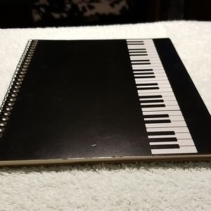 Spiral Bound Notebook of blank staff paper.